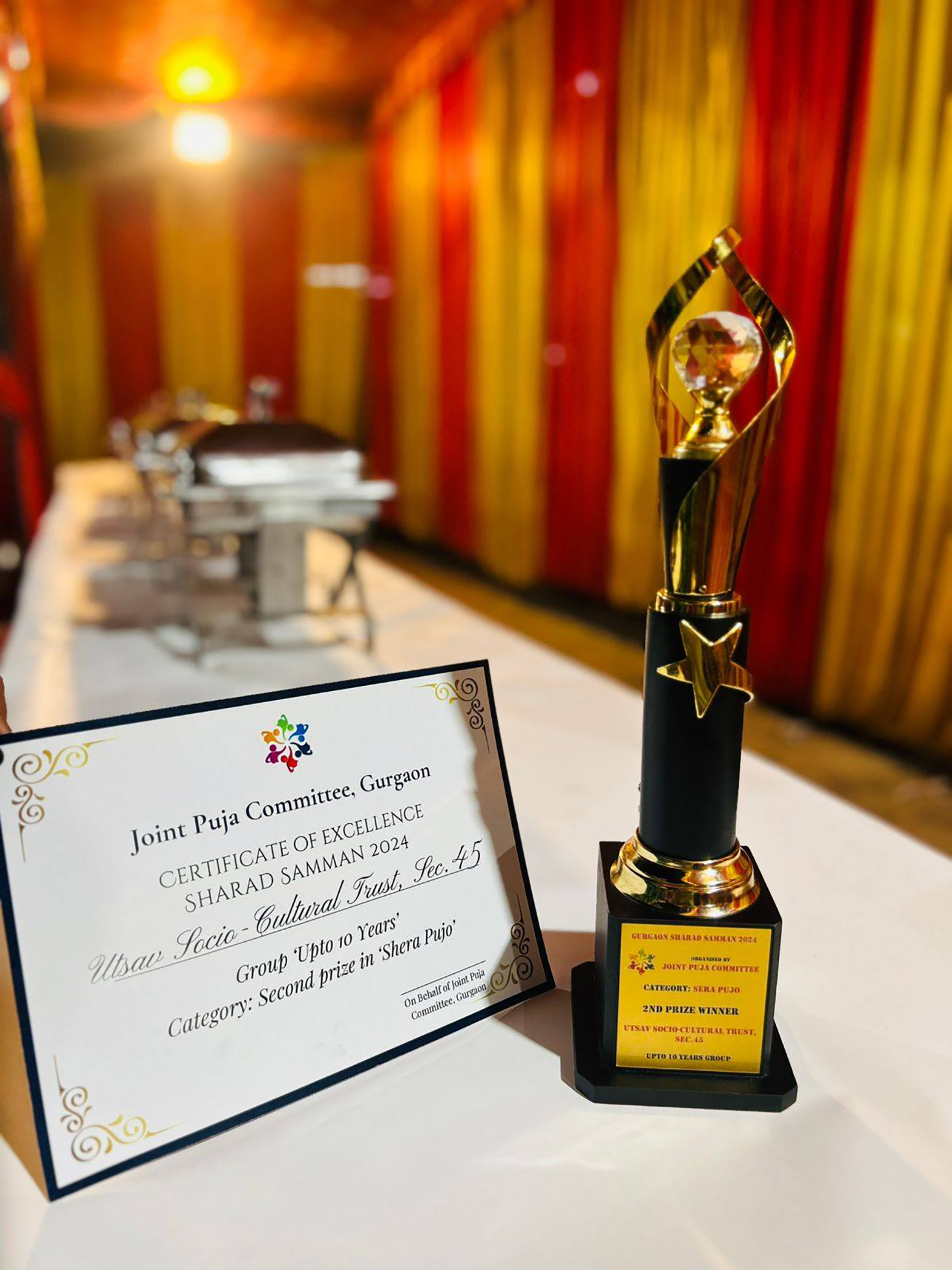 Utsav receiving the Sera Pujo award